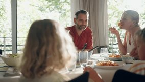 Video of beautiful family talking while eating together in the kitchen at home
 - Powered by Shutterstock - Get 15% off with code: PIKWIZARD15