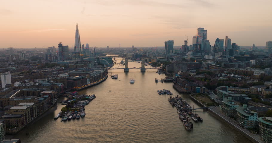 Spectacular Aerial View Of London City Skyline Over River Thames At Sunset.