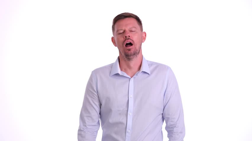 Portrait of handsome young man yawning on white background. Fatigue drowsiness and overwork | Shutterstock HD Video #1109225973