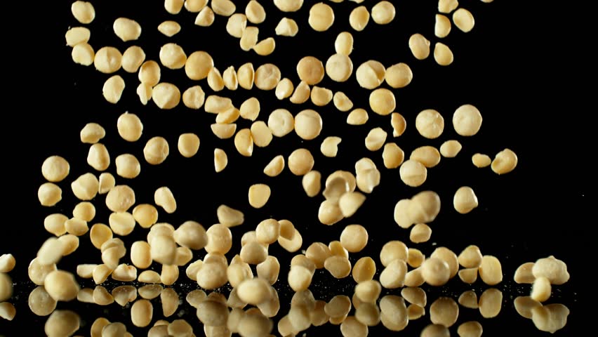 Super Slow Motion of Falling Macadams Nuts with Reflection. Isolated on Black Background. Filmed on High Speed Cinema Camera, 1000fps. | Shutterstock HD Video #1109227895