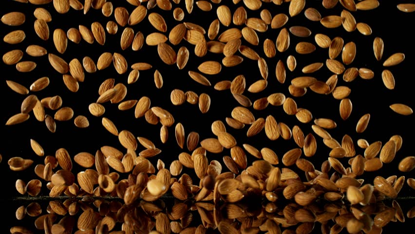 Super Slow Motion of Falling Almond Nuts with Reflection. Isolated on Black Background. Filmed on High Speed Cinema Camera, 1000fps. | Shutterstock HD Video #1109227983