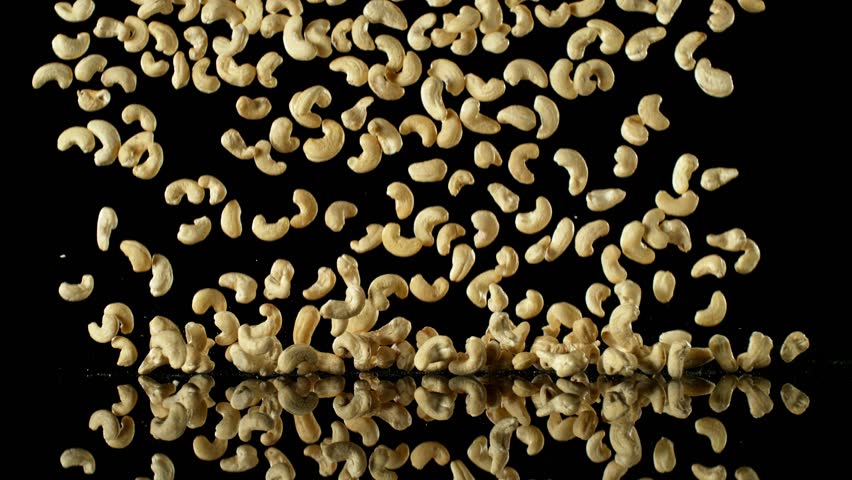 Super Slow Motion of Falling Cashew Nuts with Reflection. Isolated on Black Background. Filmed on High Speed Cinema Camera, 1000fps. | Shutterstock HD Video #1109227993