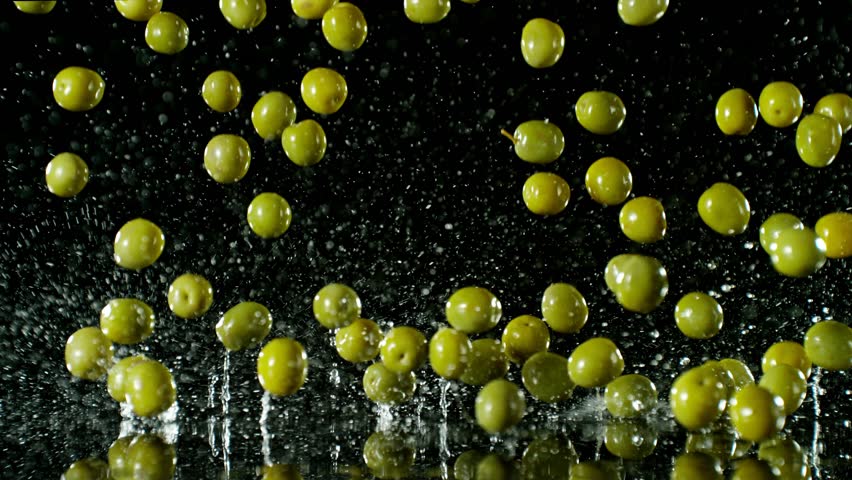 Super Slow Motion of Falling Green Olives on Black Background. Water is Splashing Around. Filmed on High Speed Cinema Camera, 1000fps. | Shutterstock HD Video #1109228431