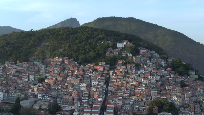 Aerial tilt down shot of Cantagalo-Pavao-Pavaozinho slums located between Ipanema and Copacabana in Rio de Janeiro, Brazil.  Royalty-Free Stock Footage #1109231445