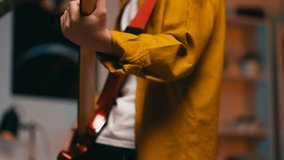 Excited teenage boy playing electric bass guitar with a friend, band rehearsal - Powered by Shutterstock - Get 15% off with code: PIKWIZARD15