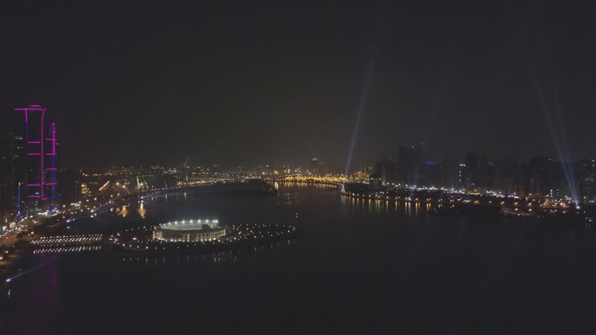 Night aerial view of Sharjah city - a city in the United Arab Emirates located in the Persian Gulf.