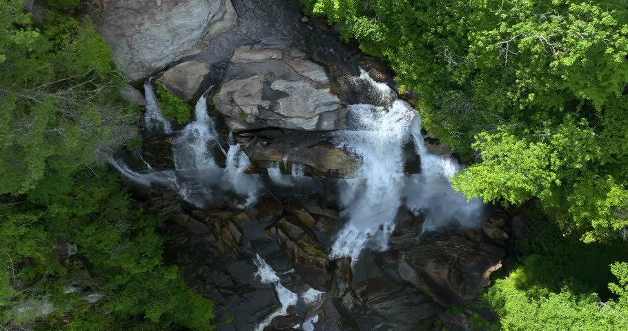 Whitewater Falls in Nantahala National Forest, North Carolina, USA. Beautiful landscape of high waterfall with falling down clear water from rocky boulders between green lush woods