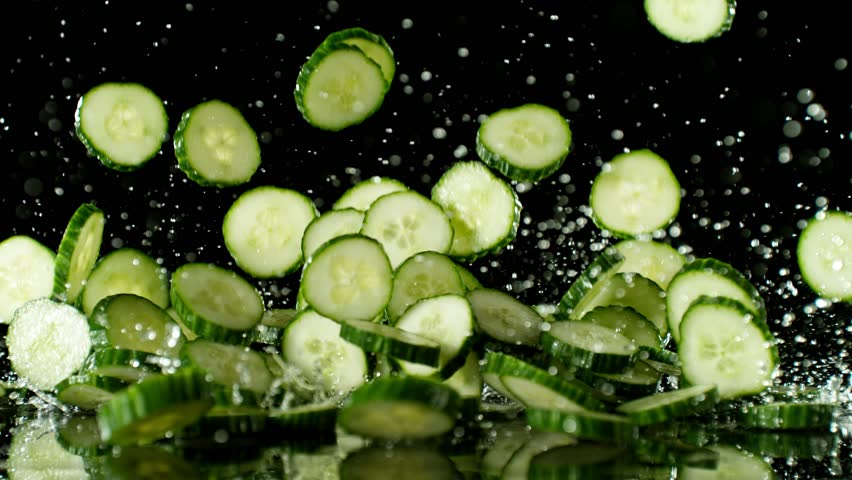 Super Slow Motion of Falling Cucumber on Black Background. Water is Splashing Around. Filmed on High Speed Cinema Camera, 1000fps. | Shutterstock HD Video #1109236999