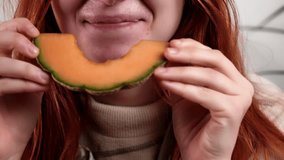 Unrecognizable woman eating melons close-up. Healthy eating, vegetarianism