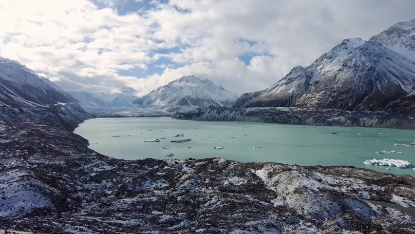 Mt Cook, New Zealand: Panorama of the stunning tasman lake and glacier in the Mt Cook region in the southern alps in New Zealand south island in winter Royalty-Free Stock Footage #1109246631
