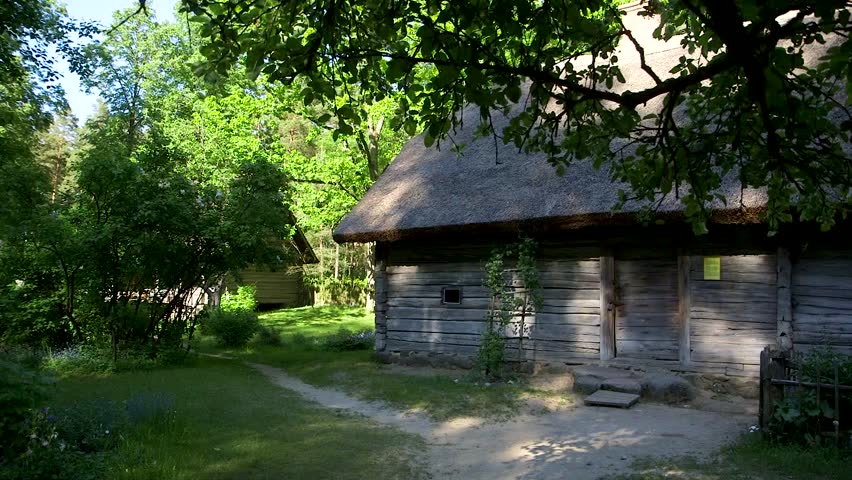 dolly wide shot of a historic log building