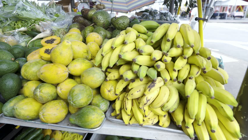 Cinematic gimbal shot of fruits stand at Farmer's Market in Hilo in Hawaii Island, USA Royalty-Free Stock Footage #1109251895