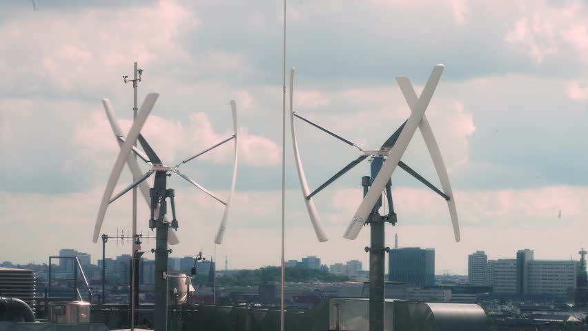 Vertical-axis wind turbine generating renewable energy on a rooftop  Royalty-Free Stock Footage #1109254697