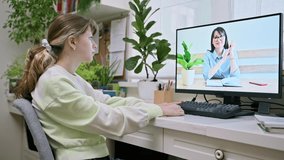 Pre-teen girl having online video conference for therapy with psychologist