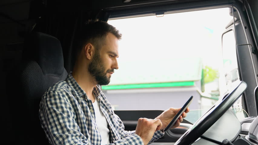 Professional trucker using truck gps navigation to transport and deliver goods to the destination Royalty-Free Stock Footage #1109255559