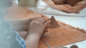 Hand of child play with clay. Teenage boy making handicrafts at home. Work of artist. Creative activity and traditional crafts concept. - Powered by Shutterstock - Get 15% off with code: PIKWIZARD15