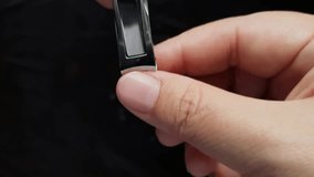 Use nail clippers to cut off thumb nail, healthcare and beauty concept. Close-up.