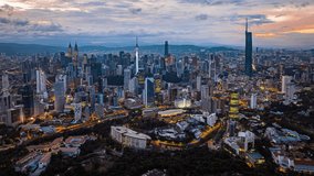 Kuala Lumpur city skyline with dramatic sky , twilight scene . Malaysia .
 - Powered by Shutterstock - Get 15% off with code: PIKWIZARD15