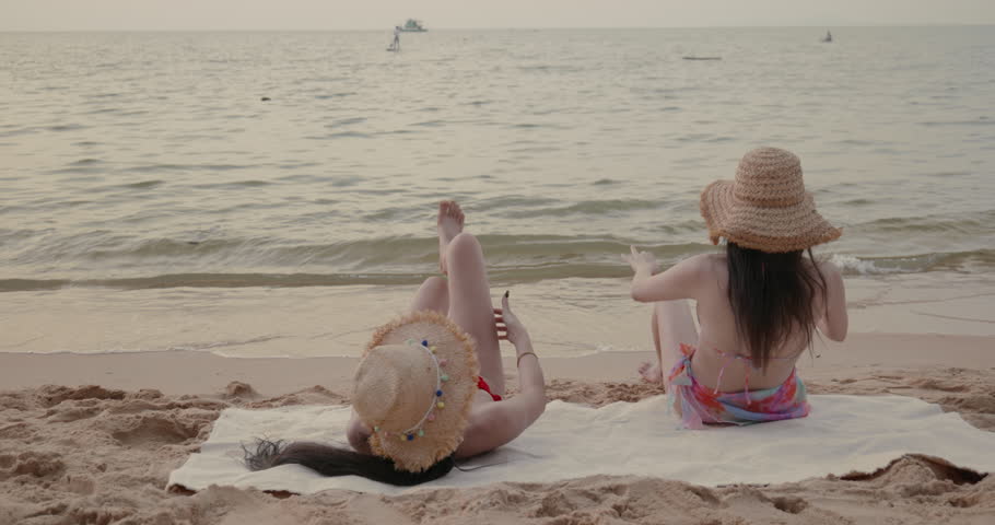 Woman wearing a bikini sunbathing on the beach