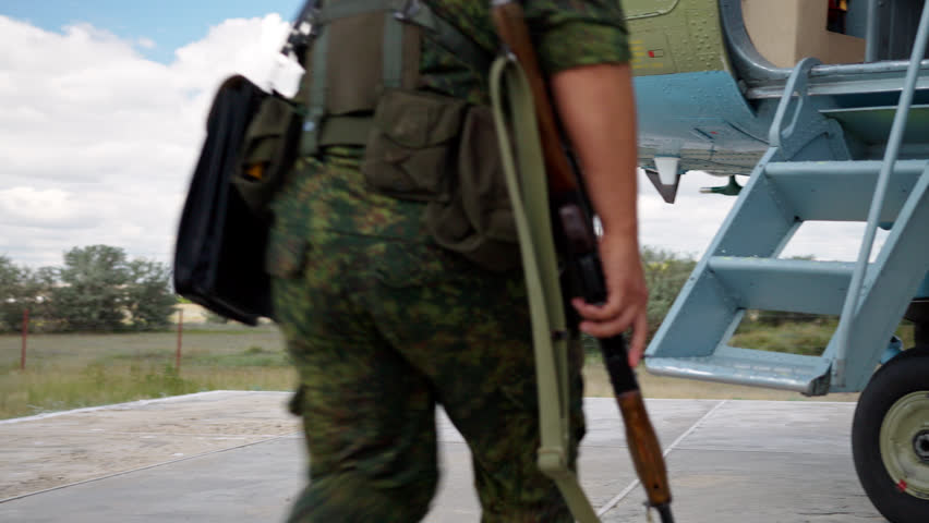 Armed soldiers board helicopter and run in plane, special forces jump in service transport. Aviation security, military action in air and special operation