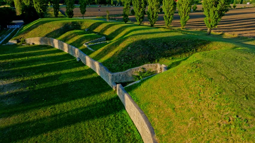 Historical Carnuntum Amphitheatre At The Archaeological Park On A Sunny Day In Austria. - aerial