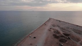 Drone video Cape Epanomi beach dunes people swim Summer sunset Mountain Olympus