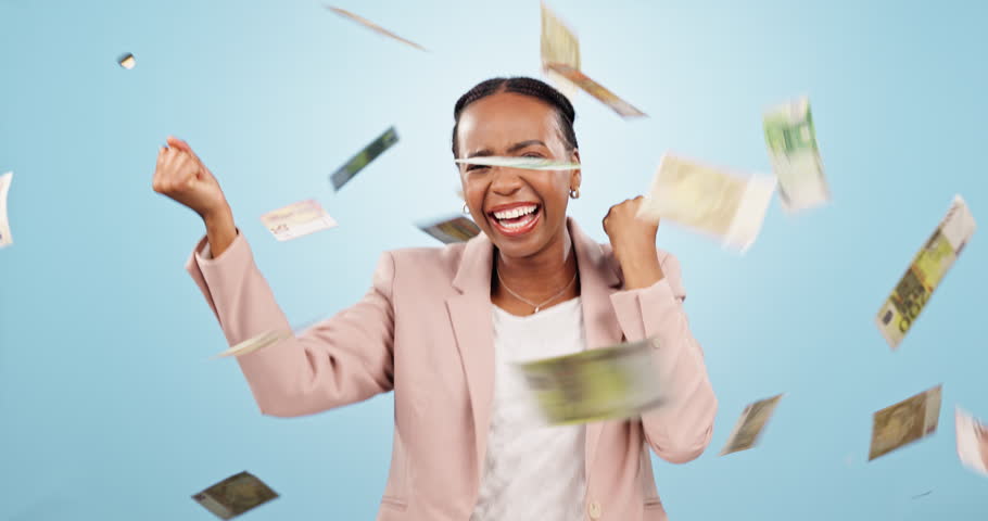 Money rain, financial freedom and excited black woman with wealth, cash and dancing isolated on blue background. Bonus, salary or income with lotto happy winner, dollar bills and cashback in studio