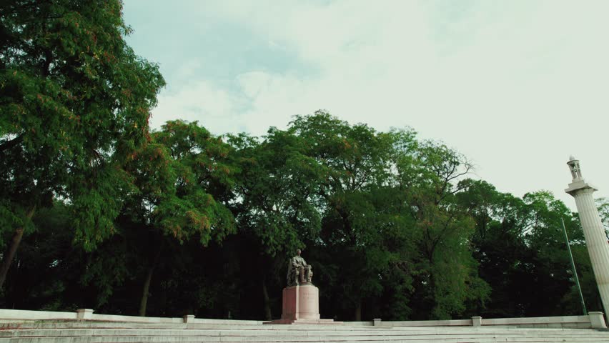 rising aerial of Abraham Lincoln monument in Chicago downtown, Illinois. Located in the north Court of Presidents, north of E. Congress Parkway and west of S. Columbus Drive
