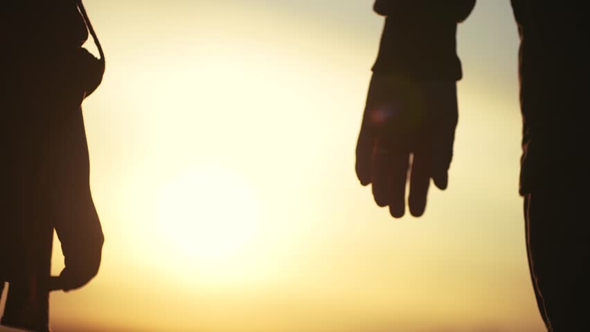 father holding daughter hands. close-up hands parent holding child girls daughters sunset silhouette. friendly family kid dream concept. fathers lifestyle day concept Royalty-Free Stock Footage #1109282777