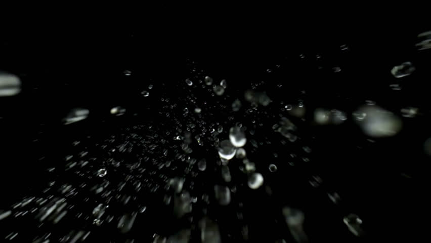 Bottom view isolated slow motion macro shooting capturing lots of clear water drops of different sizes falling down to the camera from above. Black background. Royalty-Free Stock Footage #1109284533