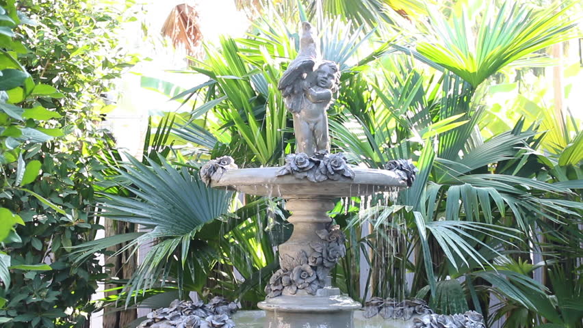 Vintage fountain decorated in resort garden, stock footage