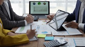 Financial analyst analysis business report on digital tablet during discussion at meeting of corporate showing the results of their successful teamwork, business meeting concept, Marketing - Powered by Shutterstock - Get 15% off with code: PIKWIZARD15