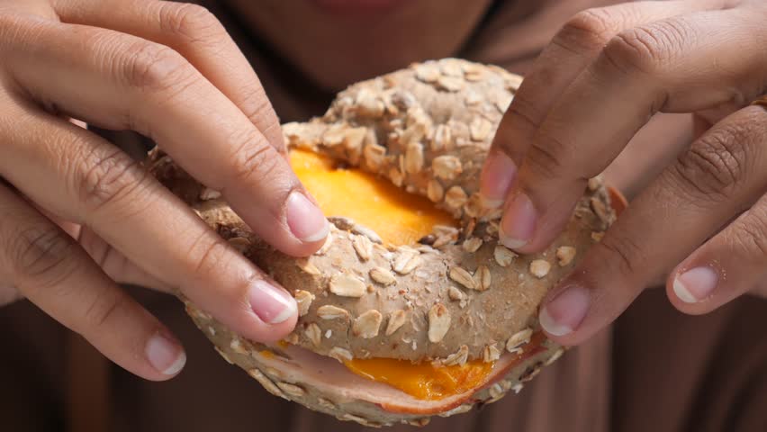 women hand holding beef burger 