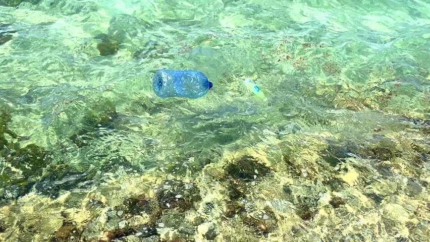 Ocean and sea is polluted with various garbage and trash, Polluted water, Unhygienic dirty water, closeup | Shutterstock HD Video #1109295695