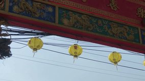 Paper lanterns and traditional colorful decoration on Chinese temple in Thailand. 4k video footage