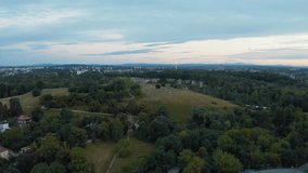 Kraków (often spelled Cracow in English), is the second-largest and one of the oldest cities in Poland. 
Drone video shot. Panorama of the evening city of Krakow. Sunset. Twilight.