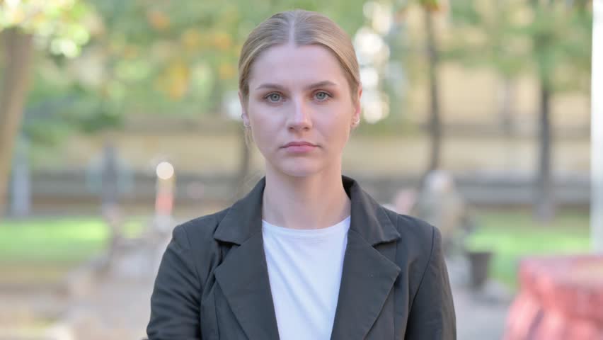 Outdoor Portrait of Tense Businesswoman in Denial