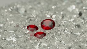 
A group of red diamonds arranged in the pile of a white diamond.
Top view of red ruby diamonds. white gems background video 4K.
Red diamonds in different size.
