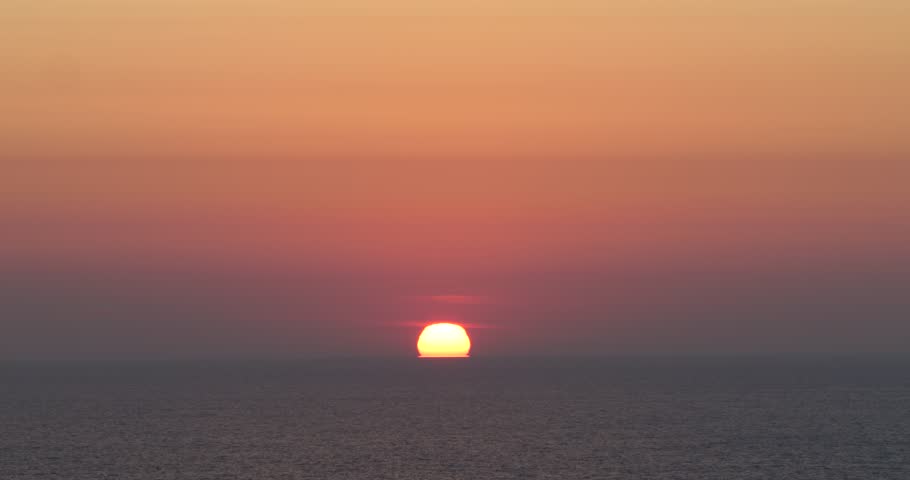 Sun rising on the first day of fall, 2023. Lake Michigan glitters beneath the sun