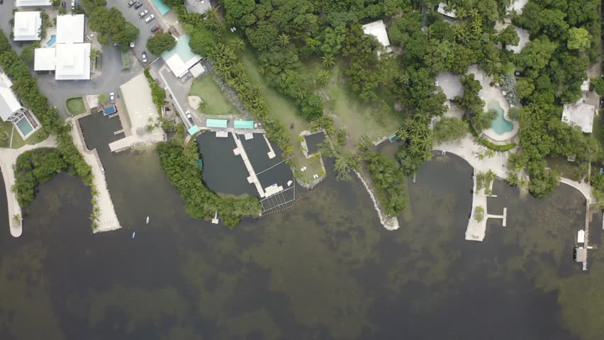 Birds eye view of ocean front properties in Key Largo, Florida Keys - 4K Drone