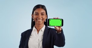 Business woman, phone green screen and mockup for presentation or advertising information in studio. Professional face of indian employee on mobile app with website tracking marker on blue background