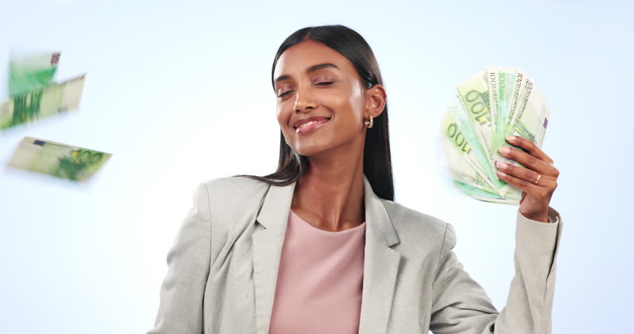 Woman, winner and money rain or fan for success, celebration and lottery, bonus or financial freedom on a blue background. Business entrepreneur with cash in air for investment or profit in studio Royalty-Free Stock Footage #1109315145