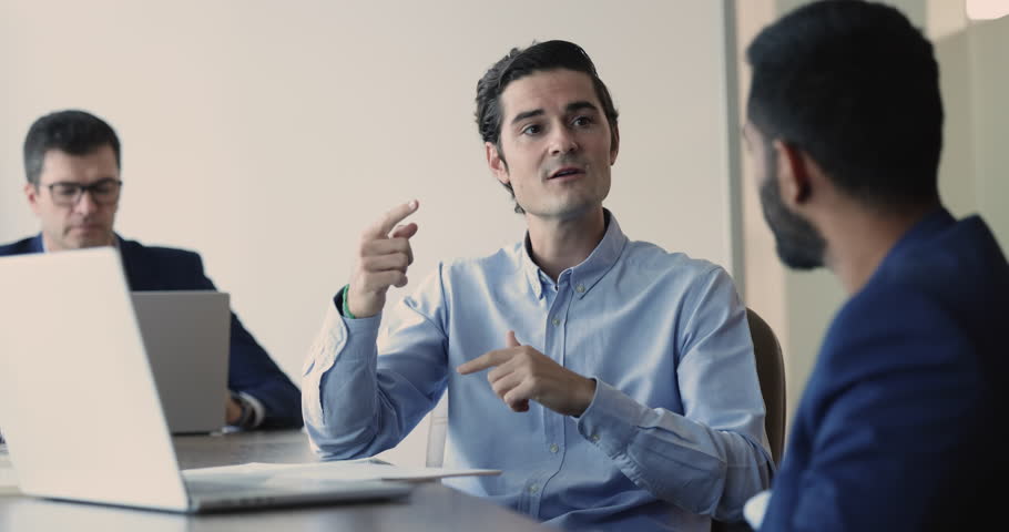 Confident middle-aged Hispanic businessman discussing investment opportunity with financial expert gathered together in office, develop startup ideas, share opinion, consulting with lawyer at meeting | Shutterstock HD Video #1109318393