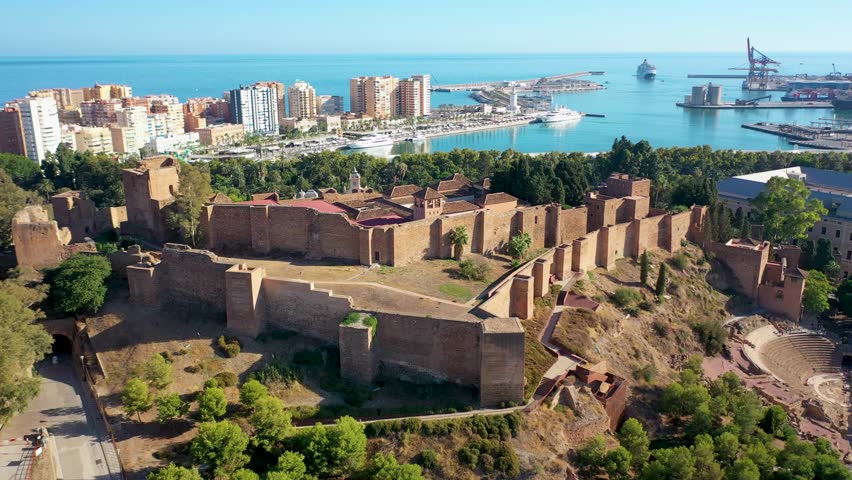 Aerial 4K video from drone to Alcazaba and Castle of Gibralfaro in the background a panoramic view of the city of Malaga and old town Malaga at sunset. Malaga,Costa del sol, Andalusia,Spain, (Series) Royalty-Free Stock Footage #1109319593