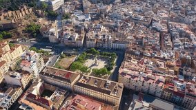 Aerial 4K video from drone to Alcazaba and Castle of Gibralfaro in the background a panoramic view of the city of Malaga and old town Malaga at sunset. Malaga,Costa del sol, Andalusia,Spain, (Series)