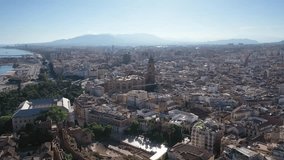 Aerial 4K video from drone to Alcazaba and Castle of Gibralfaro in the background a panoramic view of the city of Malaga and old town Malaga at sunset. Malaga,Costa del sol, Andalusia,Spain, (Series)