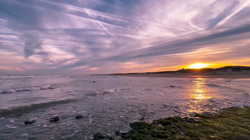 Sunset on the North Sea coast Den Haag, Netherlands. High quality 4k footage