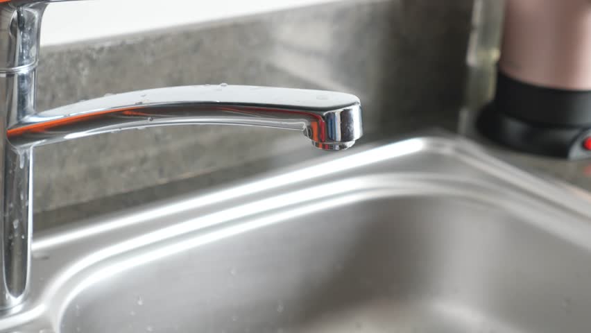  water pouring from a faucet tap in a glass, drinking pure water concept  | Shutterstock HD Video #1109322905