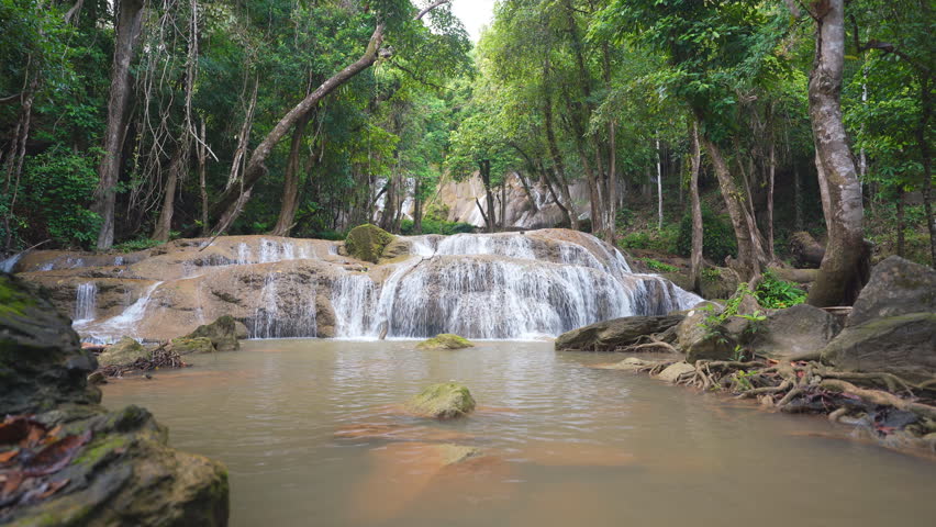 landscape waterfall clear flow motion water with natural rocks and fresh relax to nature trees jungle or green forest in summer at Pha Tad Waterfall FL3 in KhuanSrinagarindra National Park with sound Royalty-Free Stock Footage #1109323273