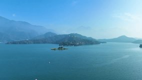 Foggy morning at a misty lake and island with drone view in sun moon lake - Powered by Shutterstock - Get 15% off with code: PIKWIZARD15
